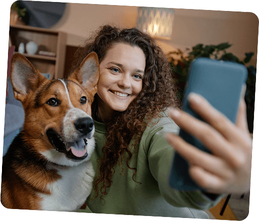 An ambassador taking a selfie with her corgi